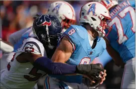  ?? ASSOCIATED PRESS FILE PHOTO ?? Tennessee Titans quarterbac­k Will Levis, right, is pressured by Houston Texans defensive end Jonathan Greenard, left, during a game last season. Greenard, who finished with 12.5 sacks last season, could be a free agent target for the Detroit Lions in this offseason.