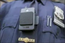  ?? MARY ALTAFFER — THE ASSOCIATED PRESS ?? In this file photo, a police officer wears a newly-issued body camera outside in New York.
