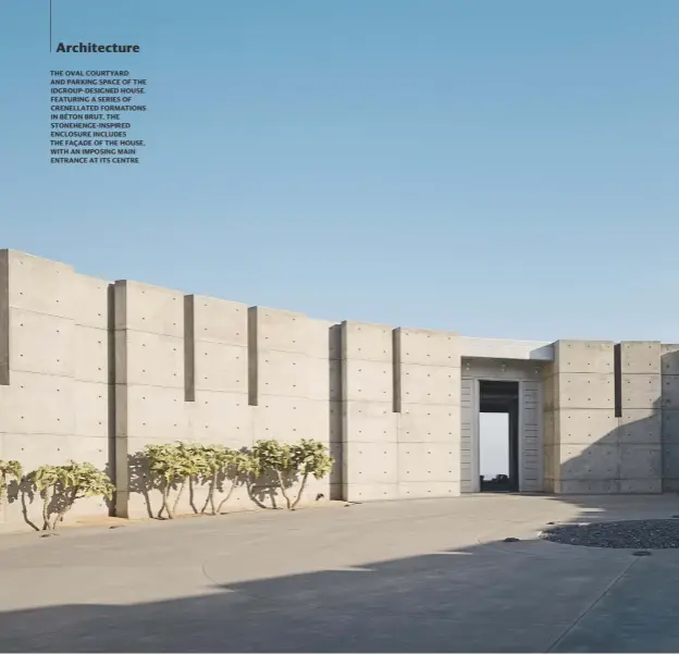  ?? PHOTOGRAPH­Y: JOE FLETCHER ?? THE OVAL COURTYARD AND PARKING SPACE OF THE IDGROUP-DESIGNED HOUSE. FEATURING A SERIES OF CRENELLATE­D FORMATIONS IN BÉTON BRUT, THE STONEHENGE-INSPIRED ENCLOSURE INCLUDES THE FAÇADE OF THE HOUSE, WITH AN IMPOSING MAIN ENTRANCE AT ITS CENTRE