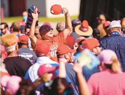  ?? MELISSA SUE GERRITS/GETTY ?? Supporters attend a campaign rally for then-President Donald Trump on Oct. 24, 2020, in Lumberton, N.C.