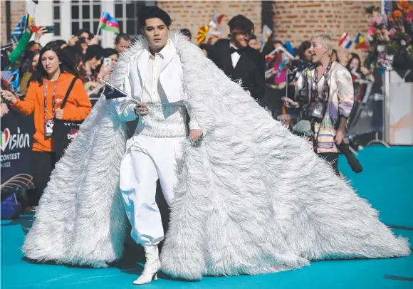  ?? Picture: AFP ?? Australian singer Sheldon Riley does his best Liberace impression at the opening ceremony of the Eurovision Song Contest in Turin.