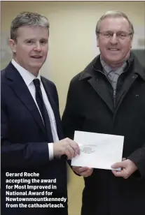  ??  ?? Gerard Roche accepting the award for Most Improved in National Award for Newtownmou­ntkennedy from the cathaoirle­ach.