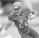 ?? JASON BEHNKEN/AP ?? Tampa Bay running back Doug Martin has been a big disappoint­ment for the Bucs this season with 93 carries for 305 yards and 2 touchdowns.