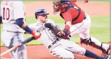  ?? Getty Images ?? Alex Bregman of the Houston Astros is tagged out at the plate by Christian Vazquez of the Boston Red Sox earlier this year.