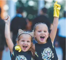  ??  ?? Sophie and Stella Wills ready to cheer on their dad.