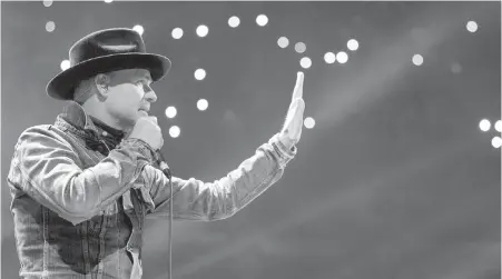  ??  ?? Gord Downie performs at WE Day in Toronto on Oct. 19, 2016, with the jacket Hudson’s Bay called the “Canadian Tuxedo.”