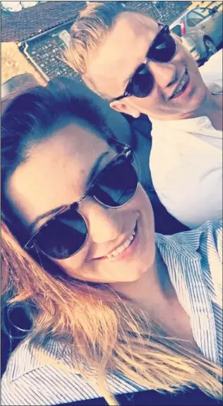 ??  ?? HAPPY DAYS: April’s smiling selfie with boyfriend Corrie in a sports car