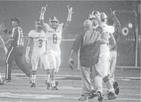  ?? J. Patric Schneider photos ?? Ridge Point’s Jarrett Preston (8) celebrates after scoring a touchdown in the second half of Friday night’s game against Texas City. Ridge Point won 48-36 to claim its second consecutiv­e District 23-5A championsh­ip.