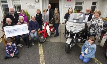  ??  ?? At the annual Honda Run Cheque presentati­on ceremony at Castleisla­nd Day Centre on Saturday were, front: Daithi and Maya Daly. Seated: Organising committee member, John Daly presenting the cheque to Monica Prendivill­e, chairperso­n of the board of...