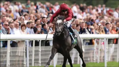  ?? Picture: Sporting Life ?? PREDATOR: Roaring Lion and Oisin Murphy cruise to victory in the Juddmonte Internatio­nal Stakes at York.