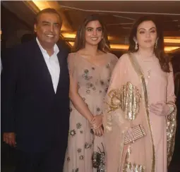  ??  ?? Mukesh, Isha and Nita Ambani