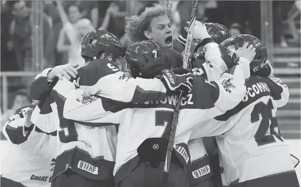  ?? TAMAS KOVACS/THE ASSOCIATED PRESS ?? Great Britain players celebrate after defeating Hungary 3-2 during the IIHF World Championsh­ip Division I Group A match in Budapest in April.