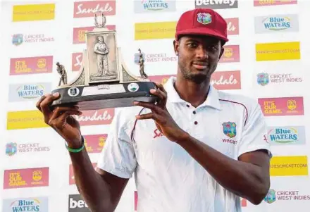  ?? AFP PIC ?? West Indies captain Jason Holder with the Wisden trophy in Saint Lucia on Tuesday.