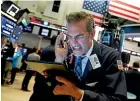  ?? AP ?? Trader Gregory Rowe works on the floor of the New York Stock Exchange yesterday. Stocks plunged on Wall Street yesterday on worries about how much President Donald Trump’s escalating trade war with China will damage the economy.