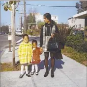  ?? Harris campaign ?? IN A 1970 PHOTO, Kamala Harris, left, Maya and their mother, Shyamala Harris, near their Berkeley apartment. Shyamala died of cancer in 2009.
