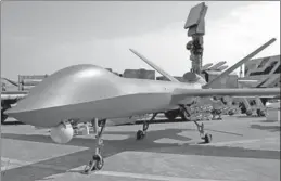  ?? FENG YONGBIN / CHINA DAILY ?? A CH-5 combat drone is on public display at the Zhuhai Air Show in Guangdong province on Monday.