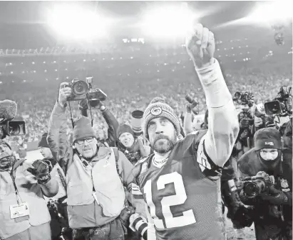  ?? WILLIAM GLASHEEN/USA TODAY ?? Quarterbac­k Aaron Rodgers basks in the afterglow of the NFC divisional round victory against the Seahawks in the Packers’ first playoff game since the 2016 season.