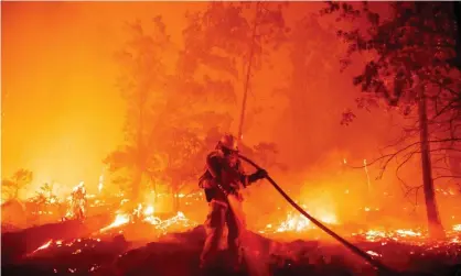  ?? Photograph: Josh Edelson/AFP/Getty ?? A firefighte­r douses flames in Madera County, California, in September.