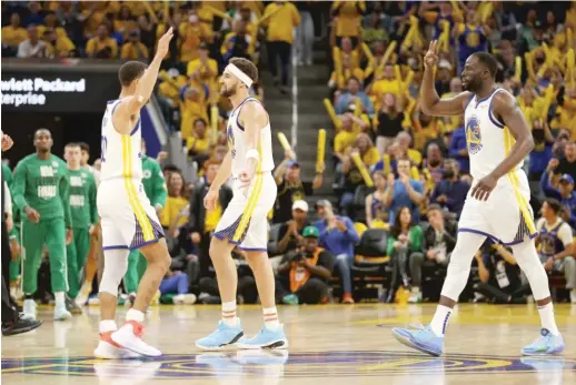  ?? EZRA SHAW/GETTY IMAGES ?? Stephen Curry (from left), Klay Thompson and Draymond Green of the Warriors have won 20 NBA Finals games together.