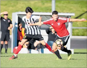  ?? TC140618SP­14 ?? TE AWAMUTU premier team captain Thomas Watts (in red) gets the better of his Matamata Swifts opponent at the Stadium on Saturday.