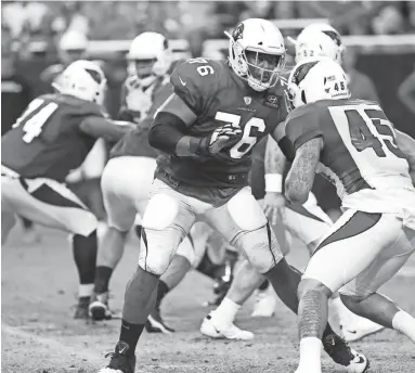  ?? MICHAEL CHOW/THE REPUBLIC ?? Cardinals offensive tackle Marcus Gilbert (76) blocks during training camp at State Farm Stadium in Glendale on July 31, 2019. Gilbert has decided to opt out of the 2020 season.