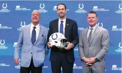  ?? ?? Shane Steichen, middle, Indianapol­is Colts owner Jim Irsay, left, and Colts general manager Chris Ballard, pose for a photo Tuesday following a news conference in Indianapol­is. Steichen was introduced as the Colts new head coach. (AP photo/ Darron Cummings)