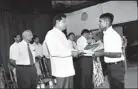  ??  ?? A driver receives his certificat­e from Transport Minister Kumara Welgama at the Ceremony