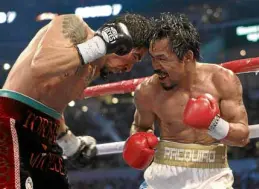  ??  ?? Pacquiao pummels Antonio Margarito