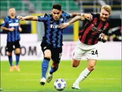  ?? AFP ?? Inter Milan forward Martinez (left) fights for the ball with AC Milan Danish defender Kjaer at the San Siro stadium on October 17.