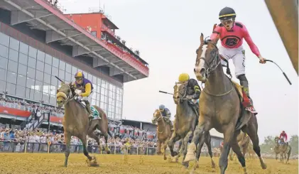  ?? STEVE HELBER/ASSOCIATED PRESS ?? Jockey Tyler Gaffalione, right, rides War of Will to victory Saturday at the Preakness Stakes in Baltimore.