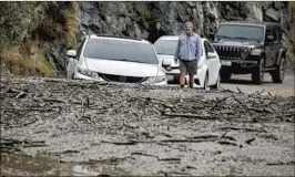  ?? Irfan Khan Los Angeles Times ?? MUD PRODUCED by heavy rain strands motorists along Highway 39 in Azusa.