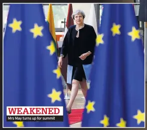  ??  ?? WEAKENED Mrs May turns up for summit