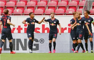  ?? AP ?? Timo Werner (centre) of RB Leipzig celebrates with teammates after scoring the first goal during their Bundesliga football match against FSV Mainz 05 in Mainz, Germany, on Sunday. Leipzig won 5-0. —