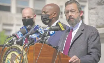  ?? BEBETO MATTHEWS/AP ?? Acting U.S. Attorney Seth DuCharme (right) announces charges against two men accused of killing Jam Master Jay. “They walked in and murdered him in cold blood,” DuCharme said.