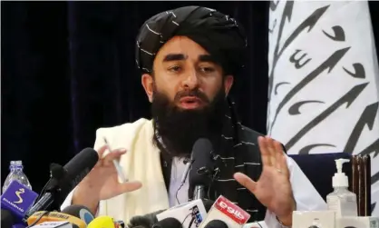  ??  ?? Taliban spokesman Zabihullah Mujahid during a press conference in Kabul on 17 August. Photograph: Reuters