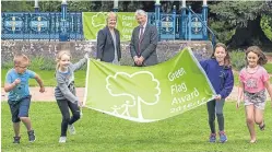  ??  ?? Roseanna Cunningham MSP and Dr Lindsay Montgomery, chairman of Keep Scotland Beautiful, with young helpers.