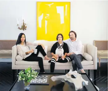  ??  ?? Pum, left, Sophie, Luna the French bulldog and Jake Lefebure in their living room. The family seeks refuge from the vividness of their work life in their home, which features a clean and minimalist palette.