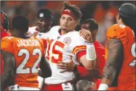  ?? The Associated Press ?? MAHOMES SIDELINED: Kansas City Chiefs quarterbac­k Patrick Mahomes (15) is helped off the field after being injured against the Denver Broncos during the first half of Thursday’s game in Denver.