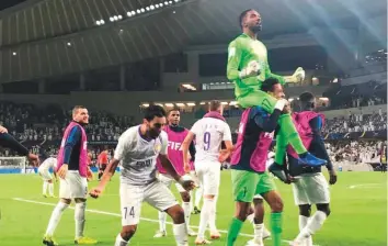  ?? Abdul Rahman/Gulf News ?? Goalkeeper Khalid Eisa is carried around by teammates after Al Ain registered a win over Wellington during the Fifa Club World Cup at Hazza Bin Zayed Stadium on Wednesday night.