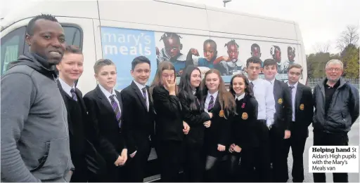  ??  ?? Helping hand St Aidan’s High pupils with the Mary’s Meals van