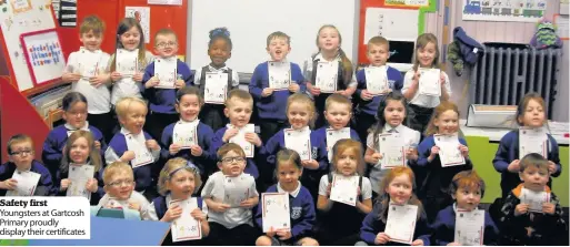  ??  ?? Safety first Youngsters at Gartcosh Primary proudly display their certificat­es