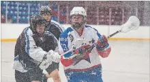  ?? BOB TYMCZYSZYN THE ST. CATHARINES STANDARD ?? Niagara’s Ken Baker-Printup, left, checks Welland’s Brock Parker in junior B lacrosse action. The Welland Generals finished the 2018 season out of the playoffs with a 1-19 record.