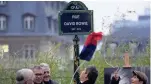  ?? CHRISTOPHE ENA/AP ?? Officials unveil the street sign of singer David Bowie during a ceremony in Paris on Monday.
