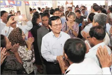  ?? FACEBOOK ?? Opposition leader Kem Sokha greets supporters at an event yesterday in Kampong Cham province.