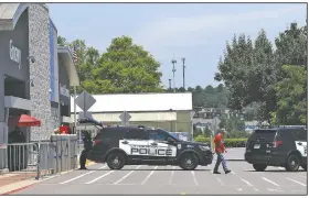  ?? (Arkansas Democrat-Gazette/Thomas Metthe) ?? Little Rock police turn away customers Sunday at the Walmart on Bowman Road after the store and the adjacent Sam’s Club were closed for the day because of protests.