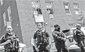  ?? — AFP file photo ?? Pro-Nicolas Maduro supporters and activists occupy the Venezuelan embassy in Washington.