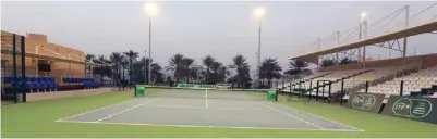  ??  ?? Oman Tennis Associatio­n chairman Khalid Al Aadi, centre, and other officials inspect the facilities at the Sultan Qaboos Sports Complex. Left, a view of the main tennis court.