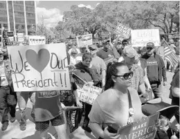  ?? CAITLIN DINEEN/STAFF ?? Several hundred supporters of President Donald Trump gathered for the “March 4 Trump” rally in downtown Orlando. Organizers promised more rallies around the country.