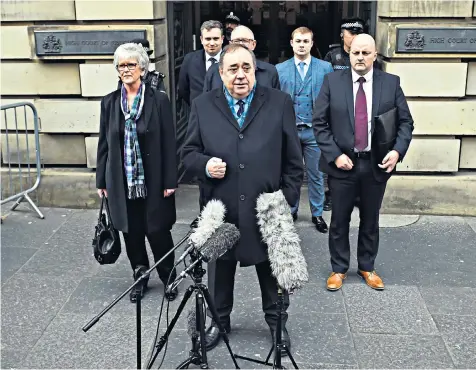  ??  ?? Alex Salmond, the former SNP leader and first minister, speaks to members of the media. Left, Nicola Sturgeon, the current First Minister