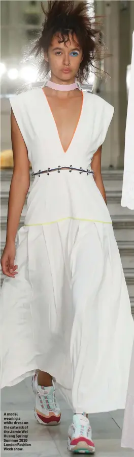  ??  ?? A model wearing a white dress on the catwalk of the Jamie Wei Huang Spring/ Summer 2020 London Fashion Week show.